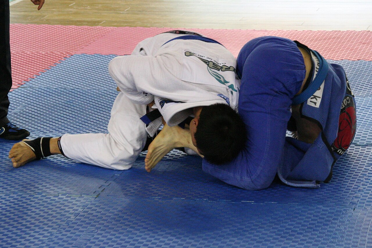Brazilian Jiu Jitsu armbar submission technique showing fundamental grappling mechanics