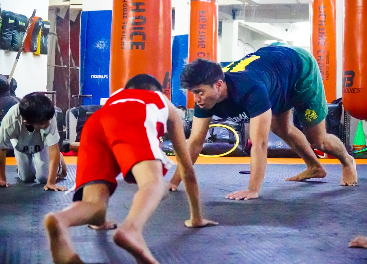 Group of BJJ practitioners on the gym floor ready for Brazilian jiu jitsu training