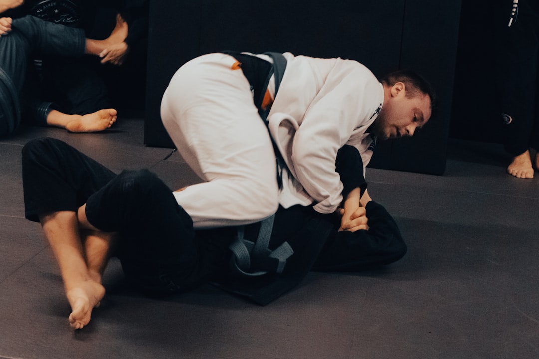 BJJ practitioner working guard position in best rashguard for grappling