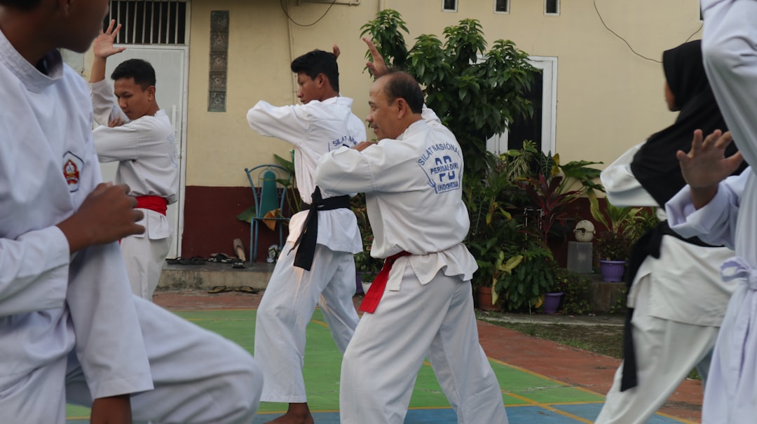BJJ beginners practicing martial arts techniques at the academy