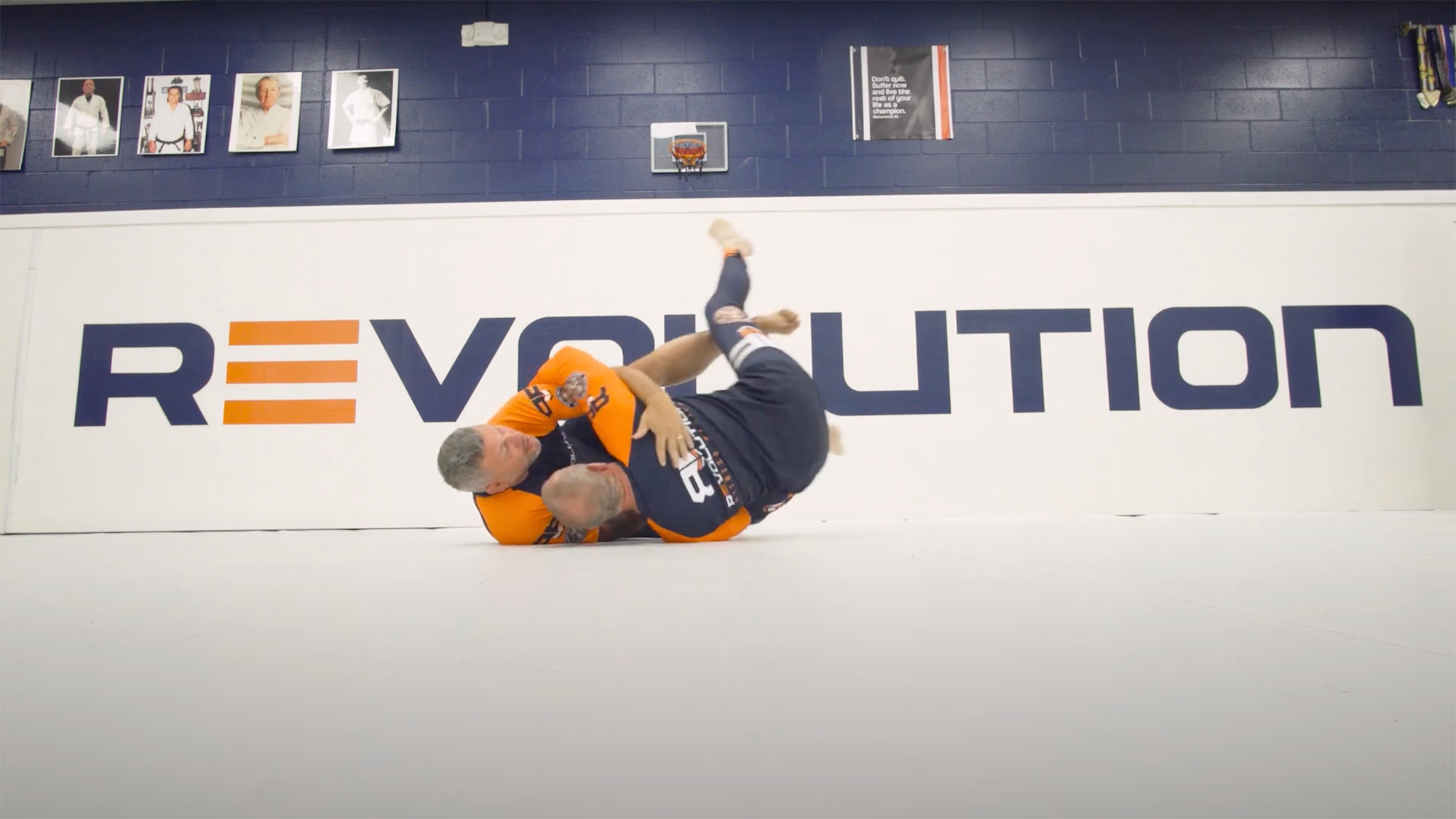 No-gi half guard butterfly sweep technique demonstrated in a Brazilian Jiu Jitsu class