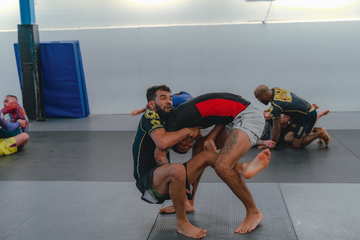 No-gi grappling scrambles during training at a BJJ gym