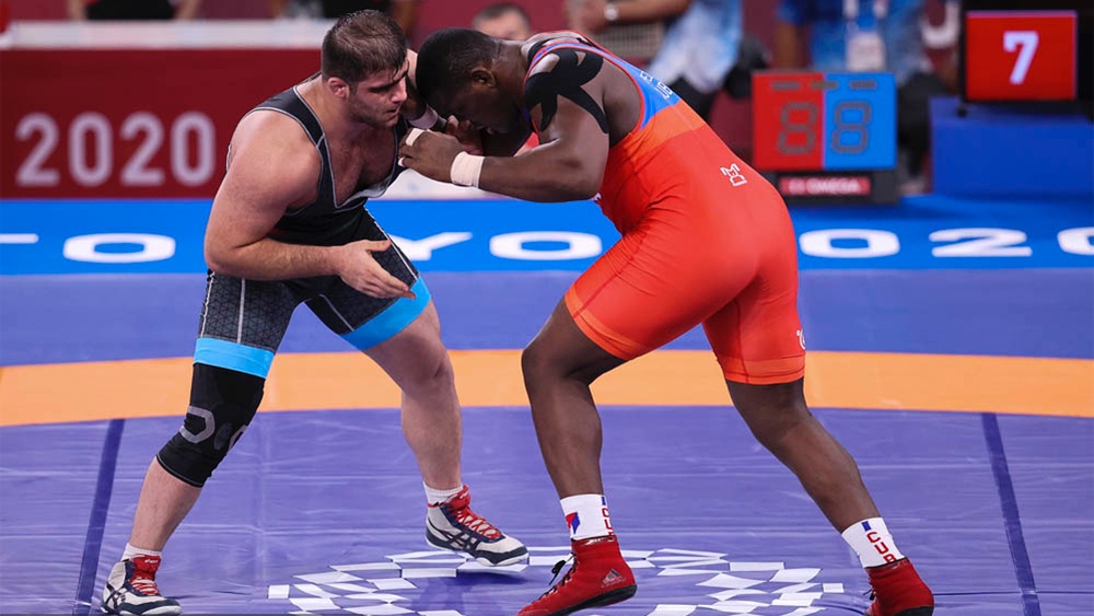 Olympic wrestling takedowns adapted for no-gi BJJ training