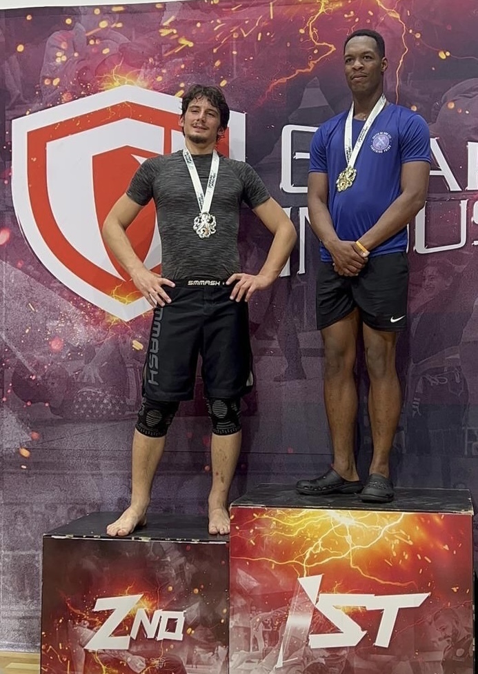 Military athlete demonstrating Brazilian jiu-jitsu skills in competition
