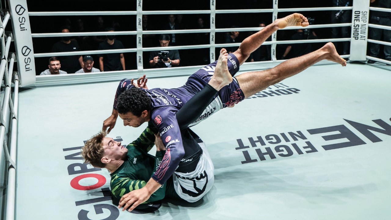 Professional grappling technique demonstration showing no-gi control and positioning