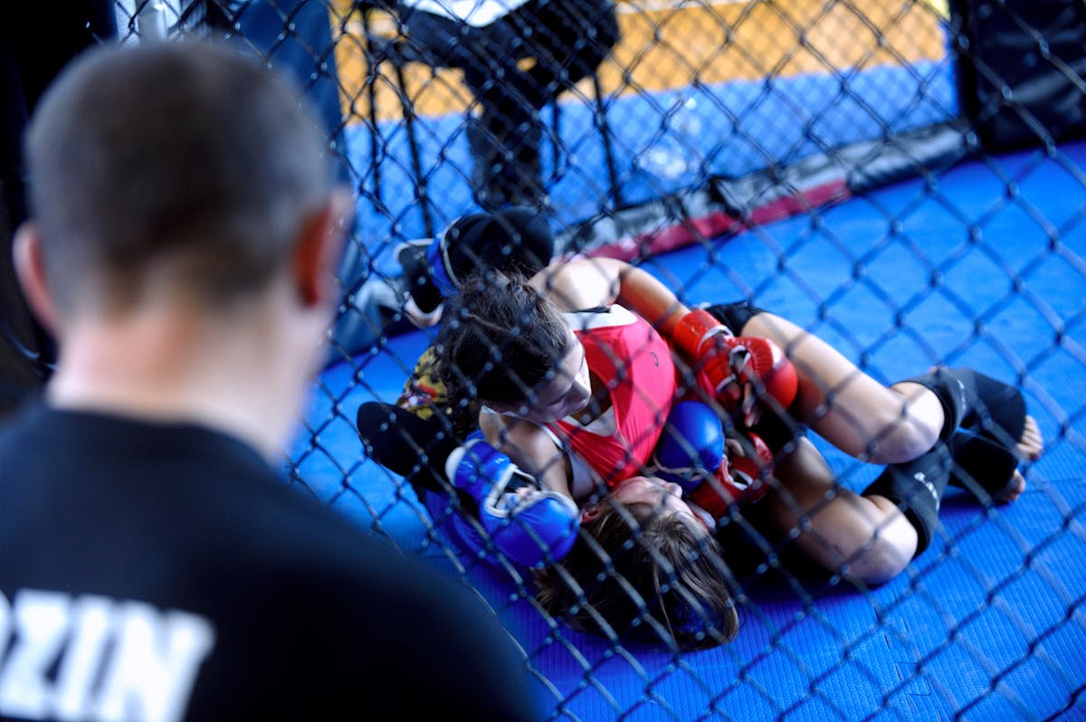Women competing in no-gi grappling competition showcasing high-level techniques