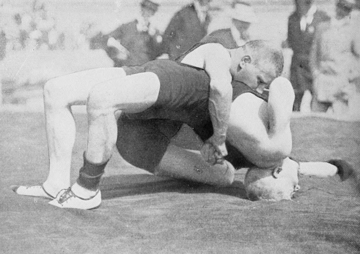 Historic wrestling competition demonstrating grappling fundamentals