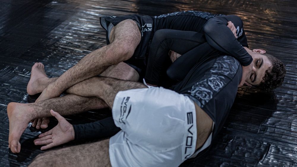 Anaconda choke no gi BJJ technique demonstrated by two grapplers in rashguard and shorts