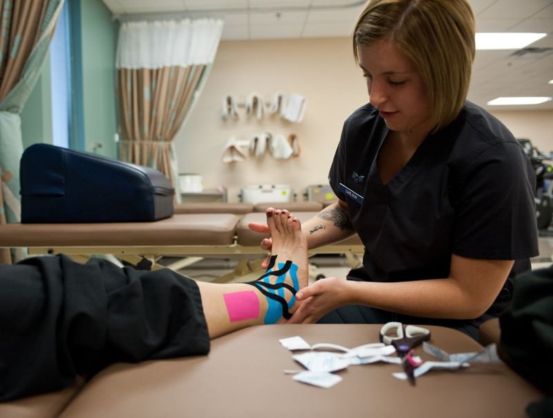 Athletic tape applied to a grappler's arm for elbow support