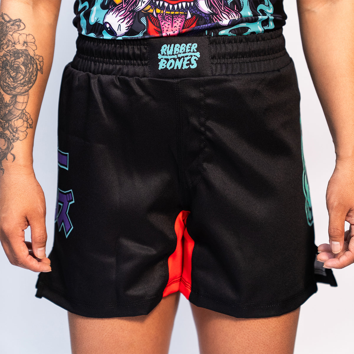 Front view of Rubber Bones Tora Oni BJJ Shorts – Black fight shorts featuring an elastic waistband with Rubber Bones branding