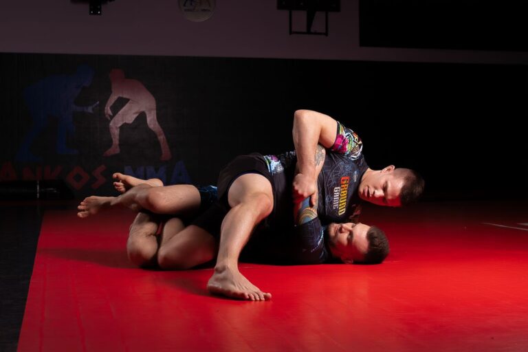 No-gi BJJ grapplers training in rashguards and shorts on the mats