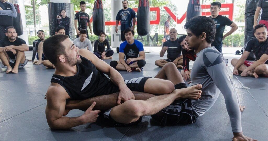 Garry Tonon teaching no-gi leg lock entries at a grappling seminar