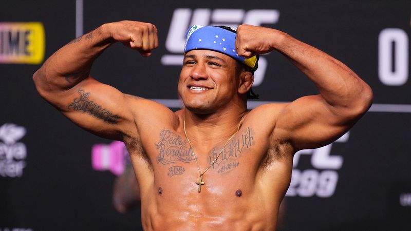 Gilbert Burns flexes at a UFC weigh-in before his UFC BJJ 9 debut against Horlando Monteiro