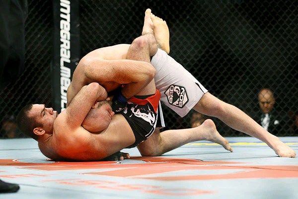 Arm in guillotine choke finish in MMA