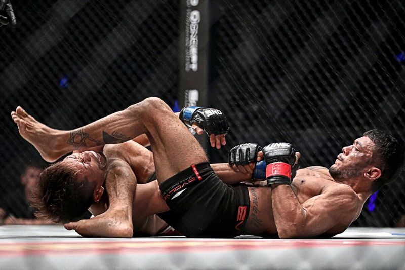 Alex Silva locking up an armbar no gi finish in the ONE cage