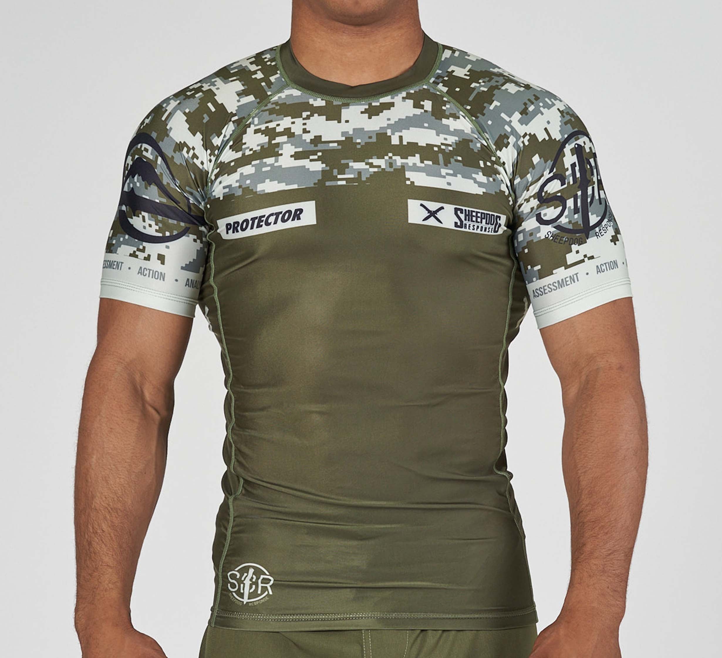 Someone wearing the Sheepdog Response Flex Lite Rashguard Military Green, featuring a fitted short-sleeve design with digital
