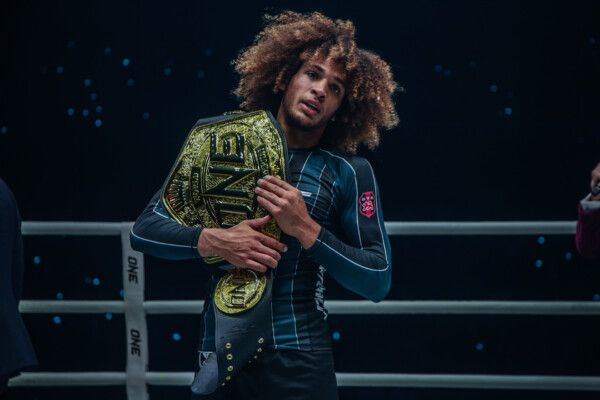 No-gi butterfly guard hook sweep grappler in rashguard