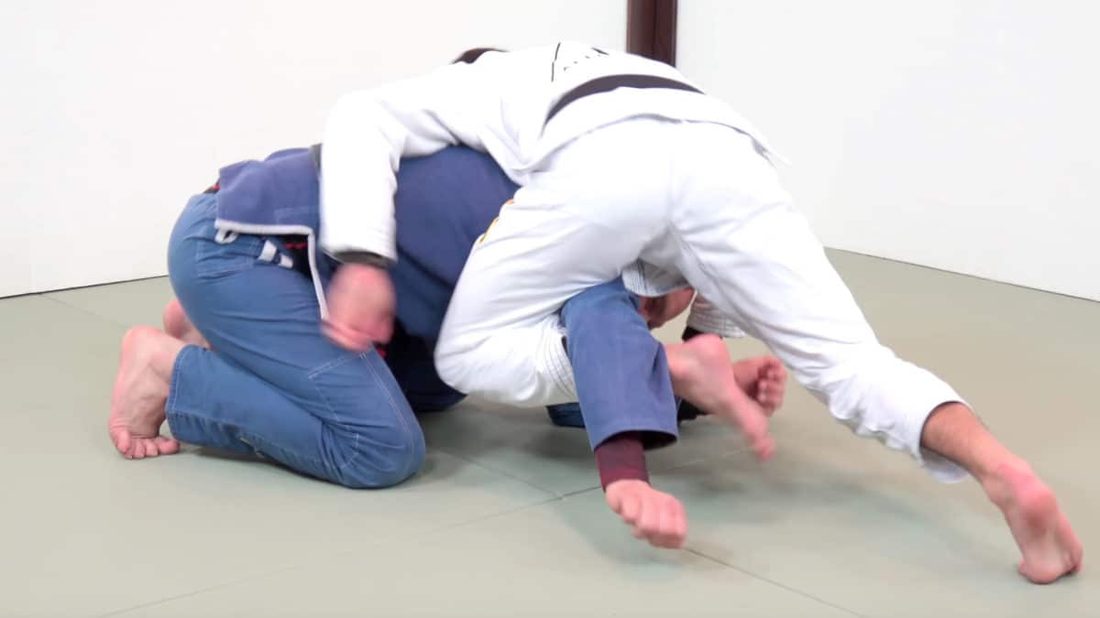 Crucifix BJJ entry hooking the far arm from turtle