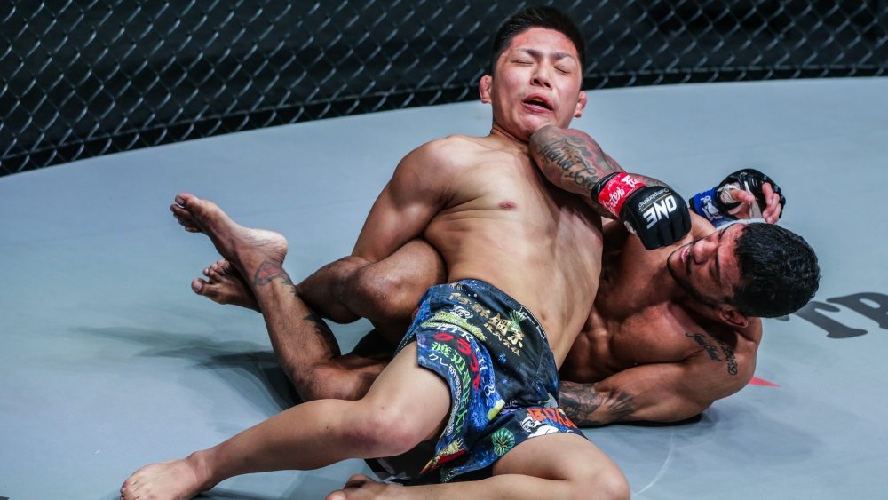 Crucifix BJJ no-gi position with both arms trapped