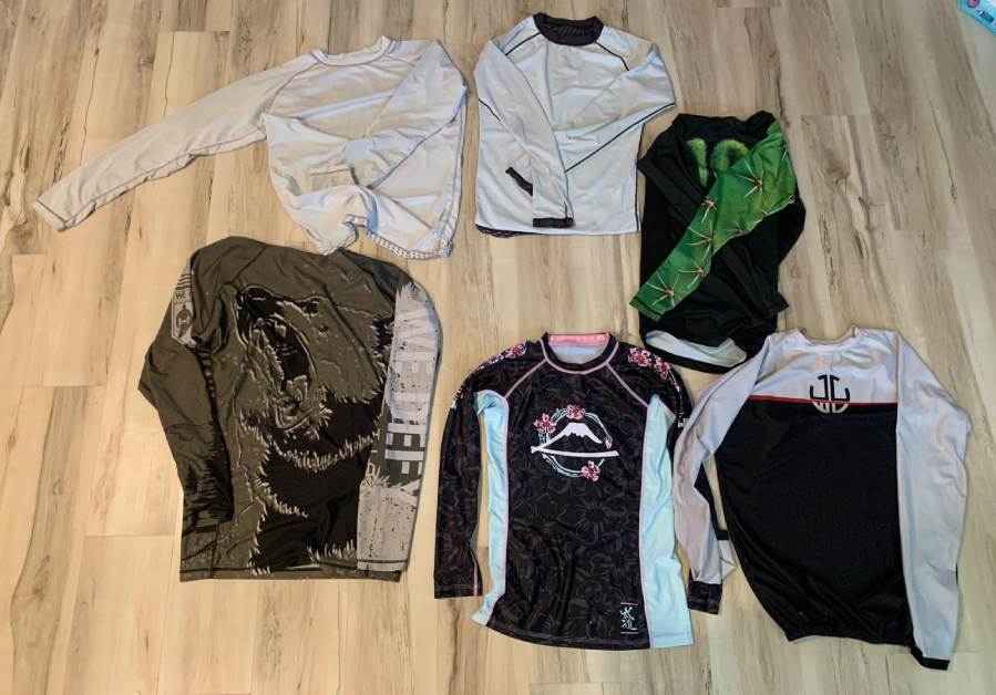 The Best No Gi BJJ Rash Guards - jiu-jitsu rashguards arranged on floor