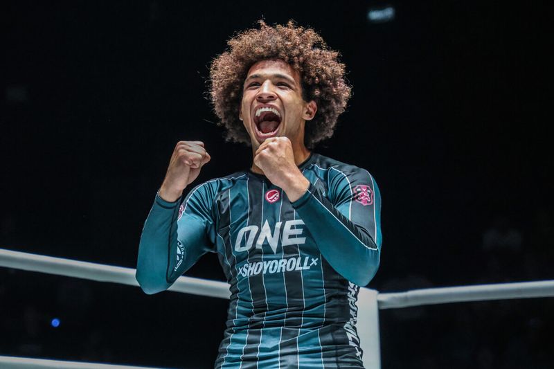 Kade Ruotolo celebrates a no-gi grappling win with the ONE world title