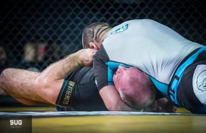 North south choke finish in a no-gi cage submission match