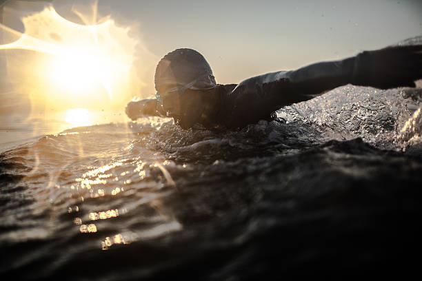 swimmer in action - ocean swimmer stock pictures, royalty-free photos & images