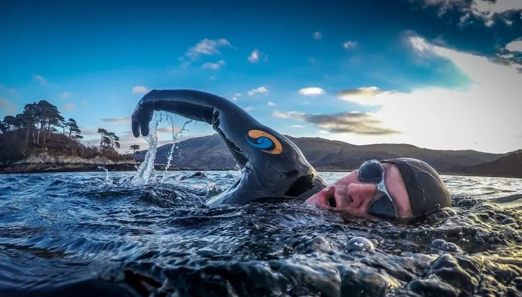 Triathlete swimming in the best triathlon wetsuit from blueseventy