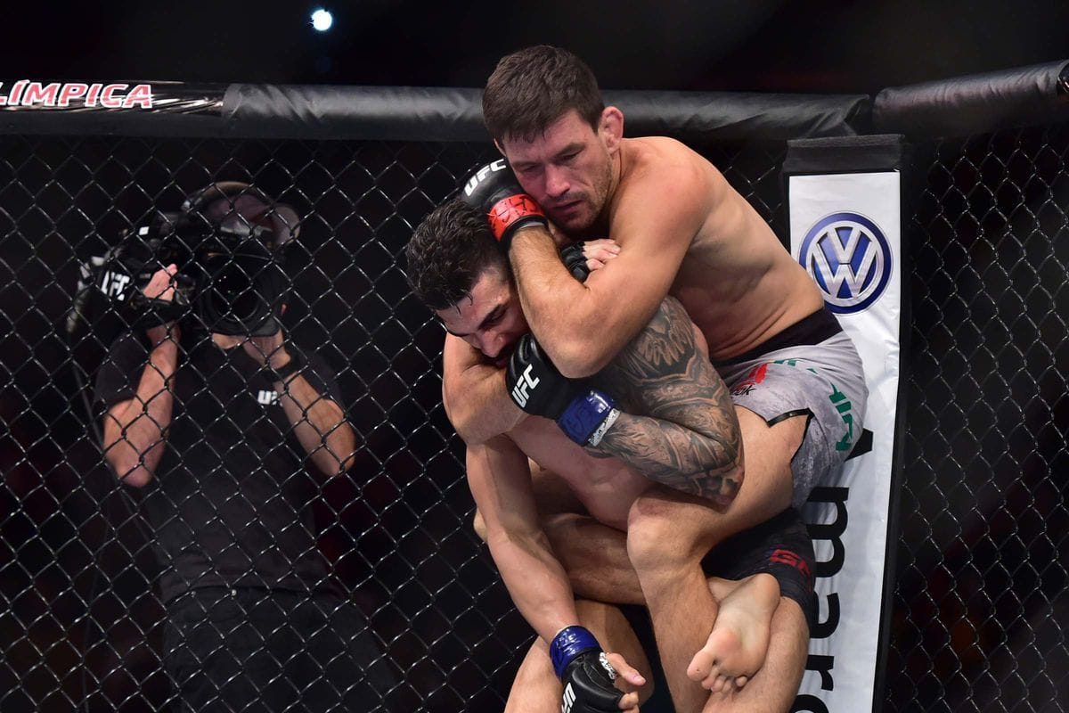 Demian Maia securing back control for a rear naked choke in a no-gi MMA bout