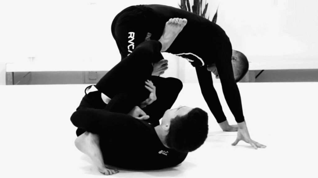Single leg X-guard no-gi BJJ player controlling the trapped leg