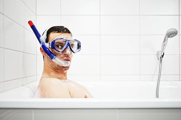 bathtub diver  snorkeling mask stock pictures, royalty-free photos & images