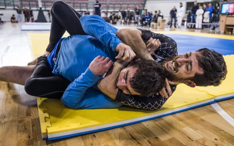 No-gi BJJ triangle choke locked in during a grappling match