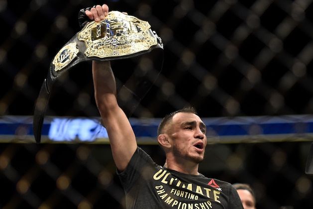 Tony Ferguson celebrates triangle choke win at UFC 216