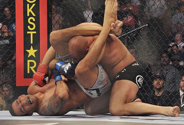 Triangle choke locked tight inside the cage no gi MMA