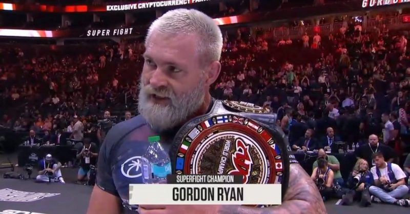 ADCC superfight title belt held after a no-gi grappling match