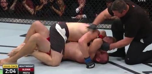 Aleksei Oleynik applying Ezekiel choke in UFC fight