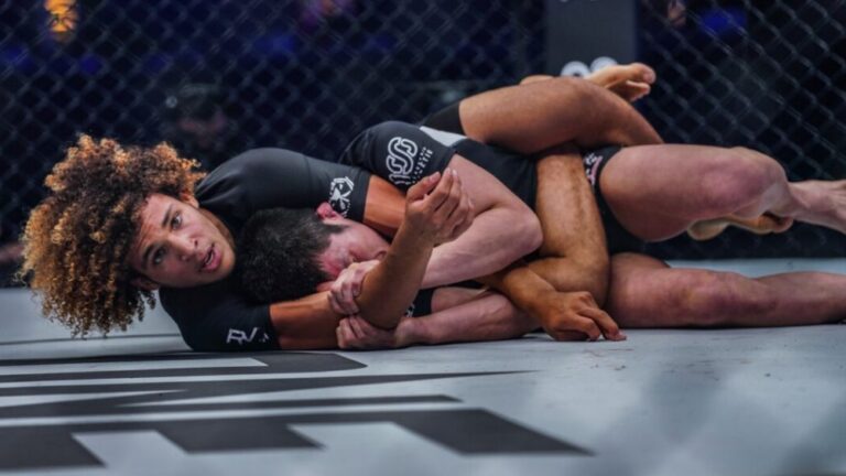 No-gi grappler securing back control with a body triangle