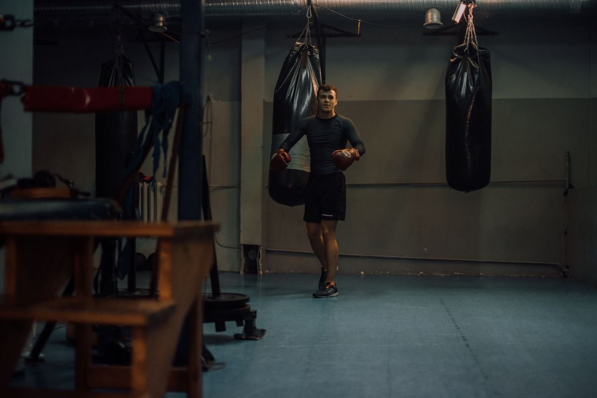 Martial artist in compression rashguard training in the gym — no-gi gear