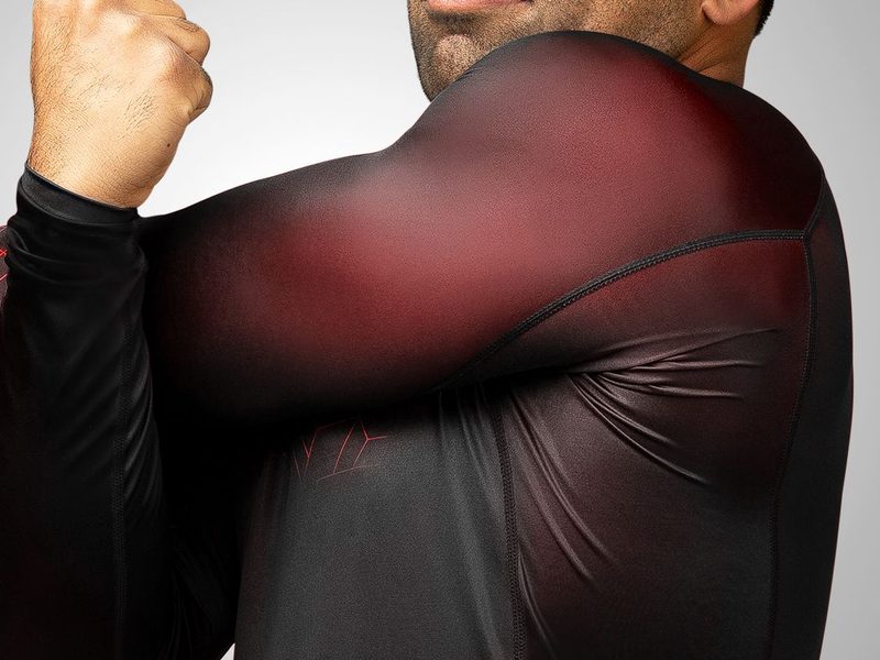 Close-up of sublimated print on a long sleeve rashguard shoulder that survives washing