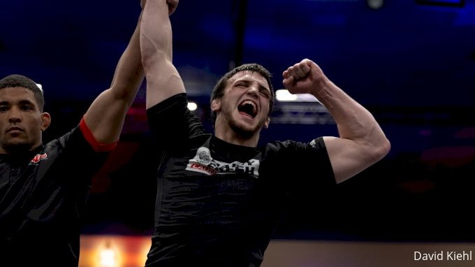 No-gi grappler victory competition rashguard arms raised submission win