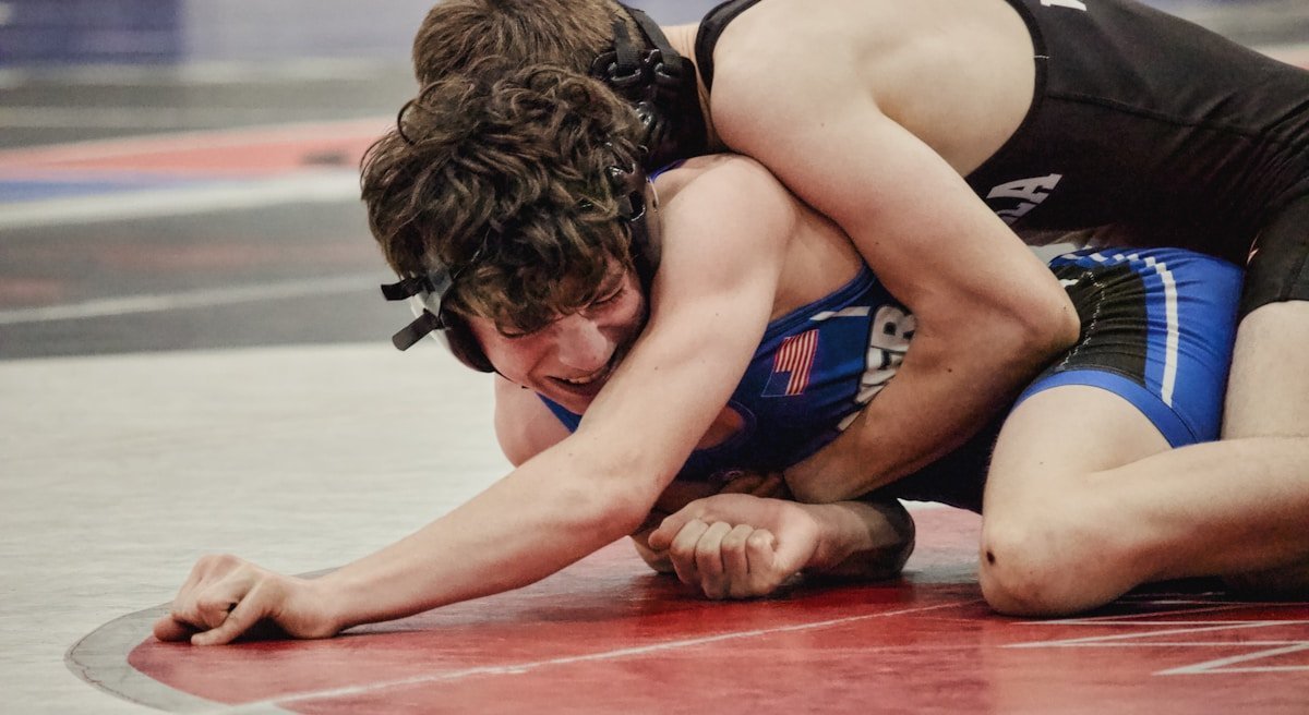 No-gi grapplers battling for position on the competition mat