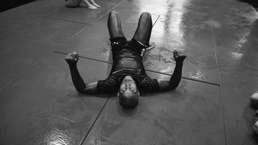 Two grapplers clinching in rashguards during no-gi training