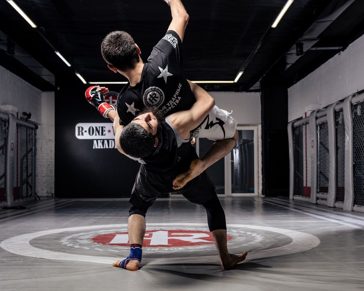 Dynamic no-gi grappling throw — rashguard compression top under competition stress