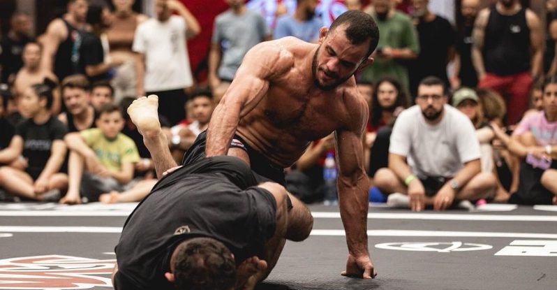 No-gi grappler establishing top control after a guard pass at ADCC