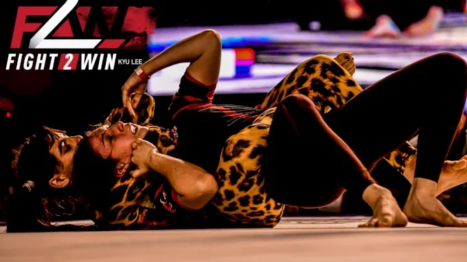 No-gi grappler in a tight compression rashguard executing a takedown during a Fight 2 Win match