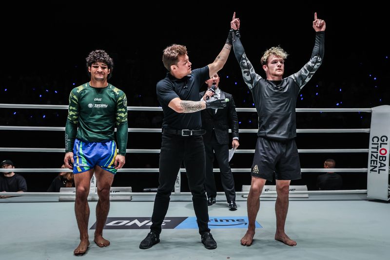 No-gi submission grappling athlete celebrating a win