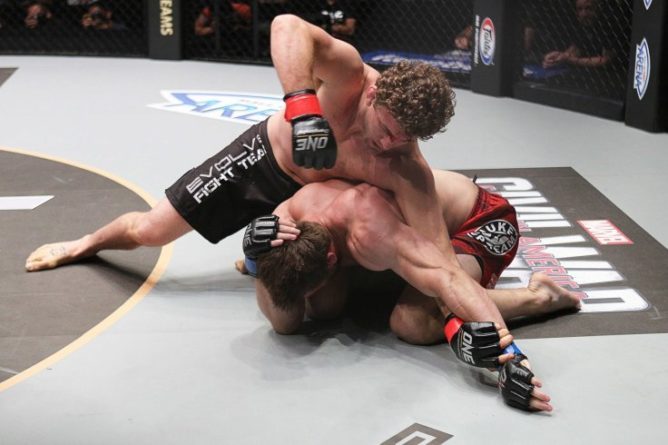 No-gi top control pressure the bottom grappler must frame against to escape side control