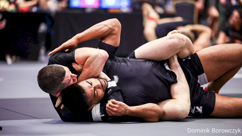 Tight no-gi grappling scramble where an ankle lock is defended
