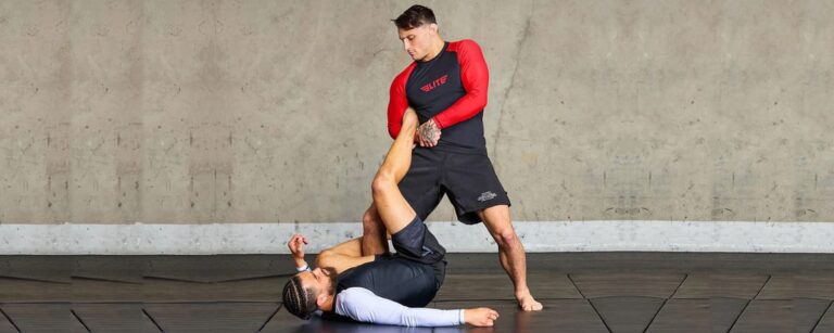 Two beginners rolling in budget rashguards under $30 during no-gi BJJ training
