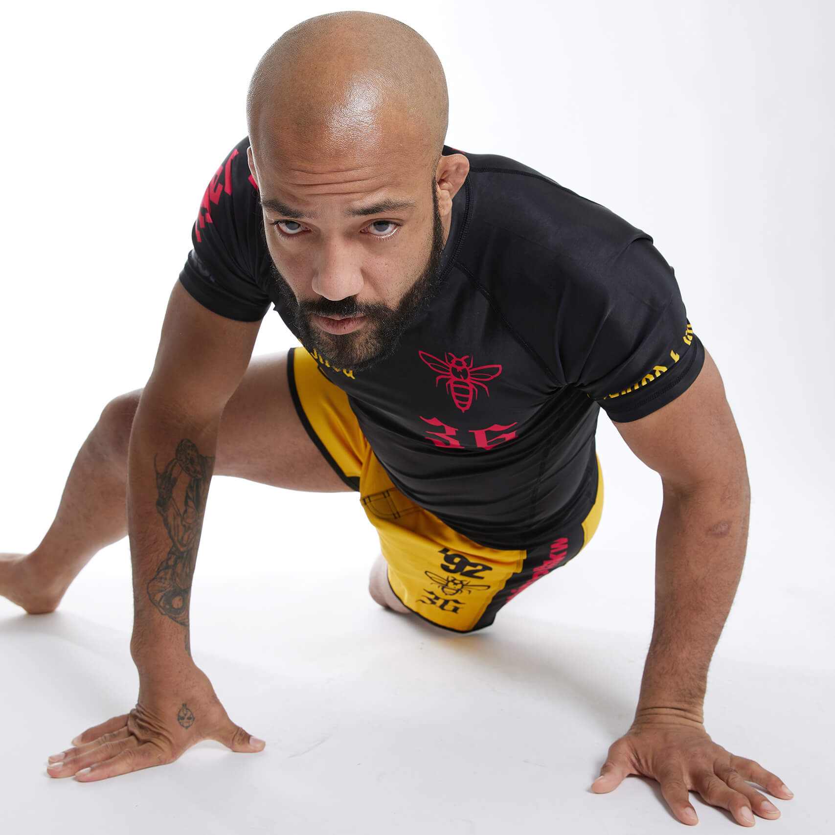 model wearing Wu-Jitsu Premium BJJ gear designed for no-gi training in a sprawl position